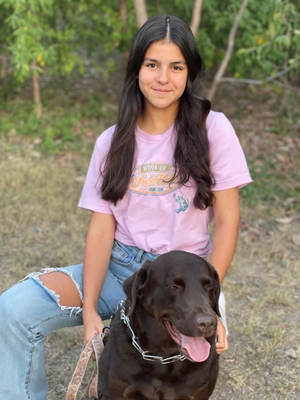 Isabella, President of Field Dress, with her trusty partner Coco.