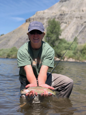 Mac, our Chairman, representing our classic fishing design while fly fishing and catching a nice rainbow trout in Colorado. 
