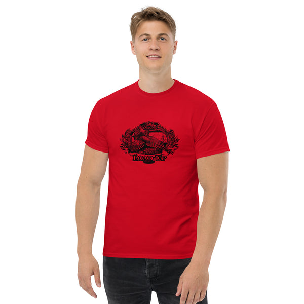 Field Dress pheasant hunting mens t-shirt shows a flushed pheasant and a distant hunter taking aim, the phrase "load-up", and the established date of firearms 1515AD.
