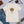 Load image into Gallery viewer, Field Dress Evolution of Archery t-shirt showing a archer from the Asian empire, a native American indian, and the present day on the sun's horizon.