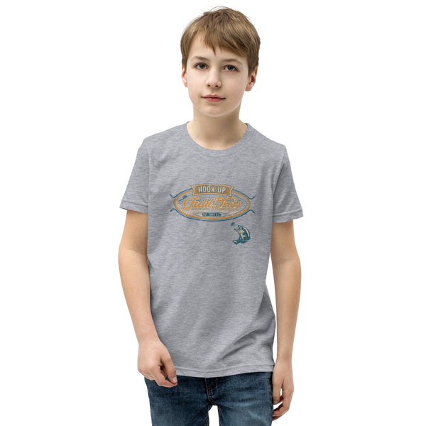 Field Dress classic kids fishing tee showing a bass about to take the hook, the phrase "hook-up", and the established date of fishing around 2000BC.